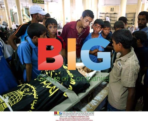 Palestinians view body of Amin Sufi, 21, during Gaza funeral