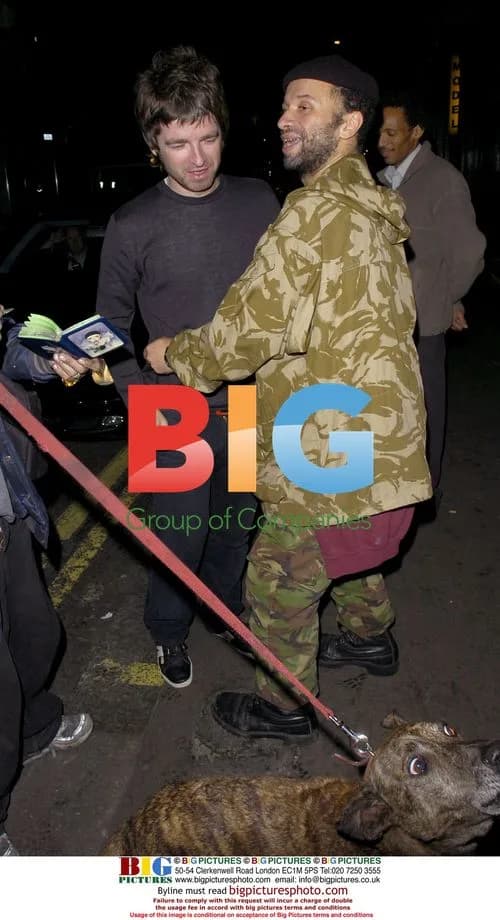 Noel Gallagher and Sara McDonald leaving Groucho Club