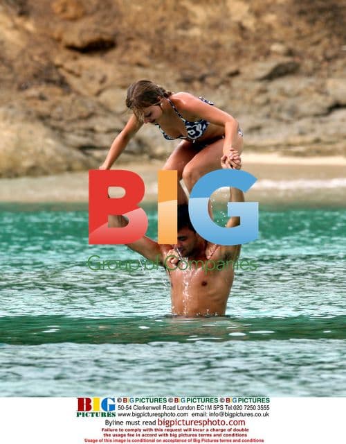 Tina O'Brien and Ryan Thomas on Greek beach