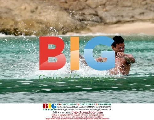 Tina O'Brien and Ryan Thomas on beach in Greece