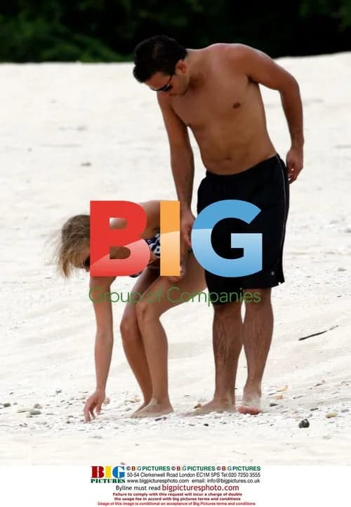 Tina O'Brien and Ryan Thomas on Greek beach