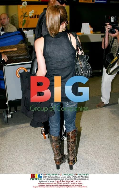 Hilary Duff Tries to Appear Demure at LAX