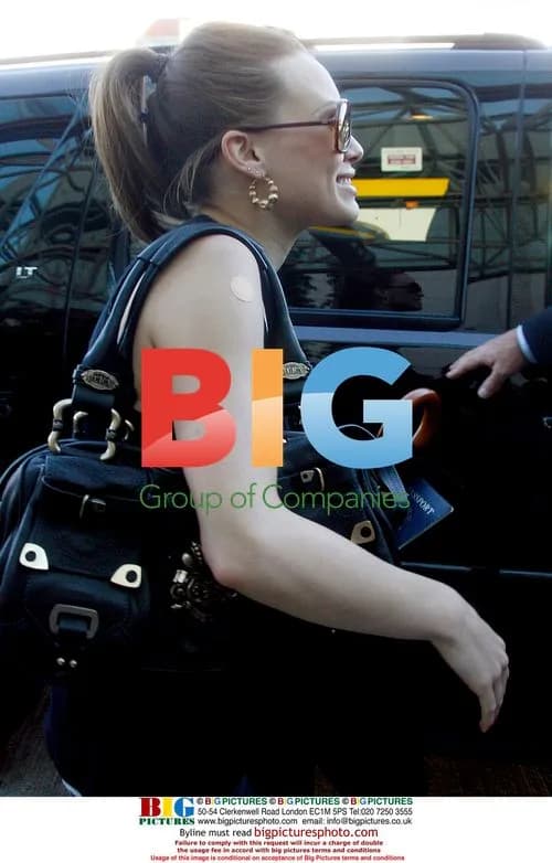 Hilary Duff Attempting Demure Look at LAX