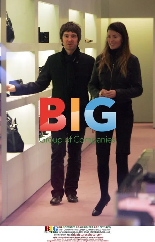 Noel Gallagher and Sara McDonald shopping at Prada