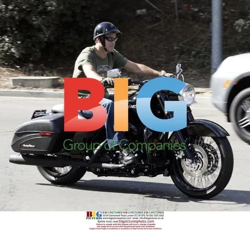George Clooney rides Harley around town