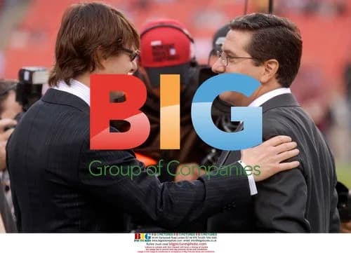 Tom Cruise and Dan Snyder speak on sidelines
