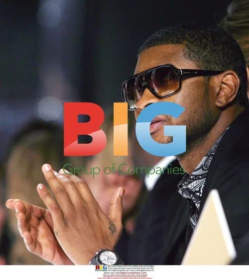 Usher Applauds Kors at Fashion Week