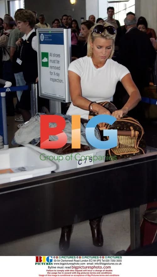 Jessica Simpson checks in dog at LAX