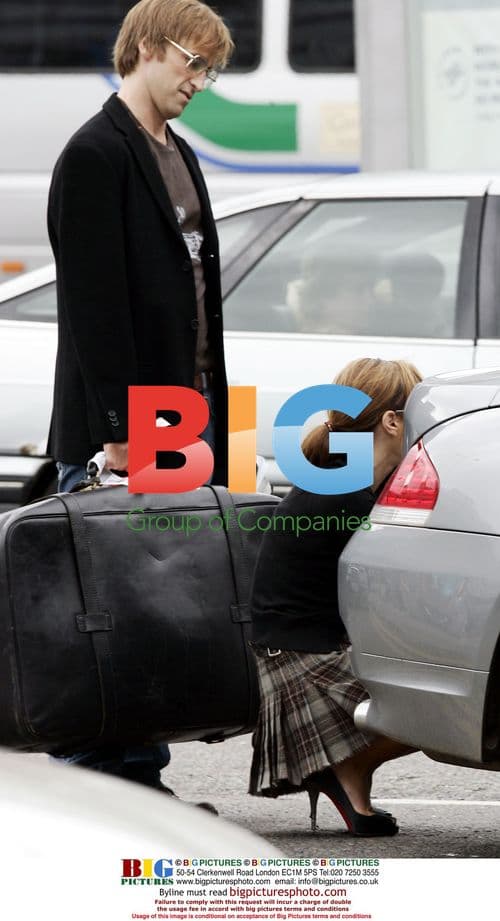 Tara Palmer Tomkinson meets new boyfriend Crispian Belfrage at Heathrow