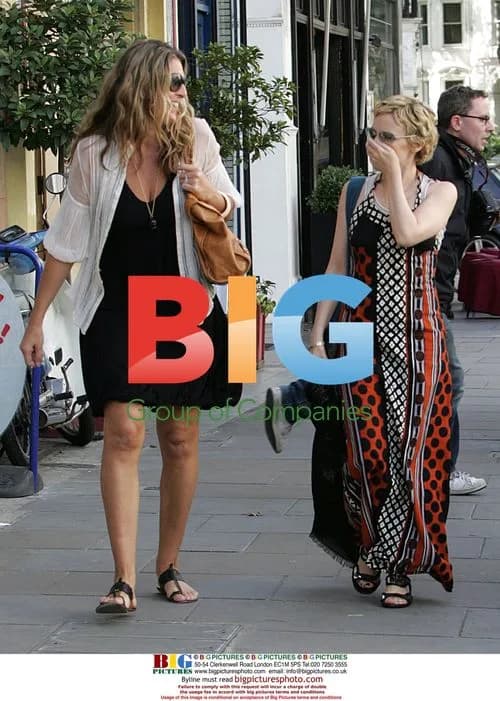 Kylie Minogue Accepts Flower Pot on London Stroll