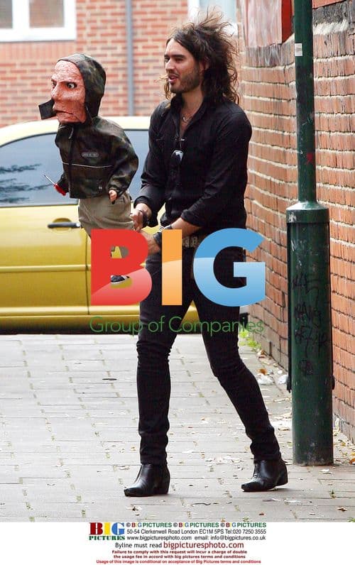 Russell Brand Plays with Puppet on TV Show Filming