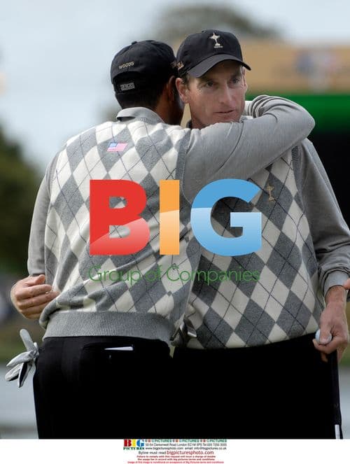 Tiger Woods hugs teammate Jim Furyk