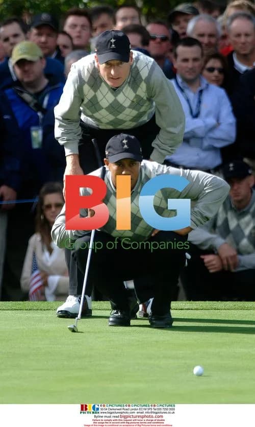 Tiger Woods and Jim Furyk line up putt