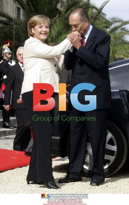 Chirac Kisses Merkel's Hand