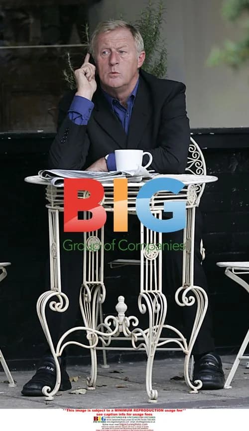 Chris Tarrant drinks coffee outside cafe