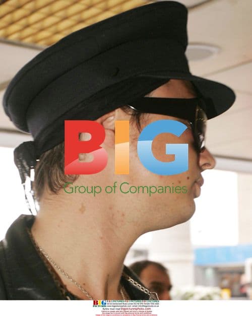 Pete Doherty wears dark shades and appears to have a black eye at Heathrow