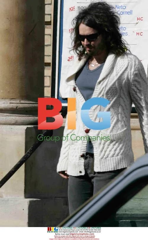 Russell Brand leaves London church