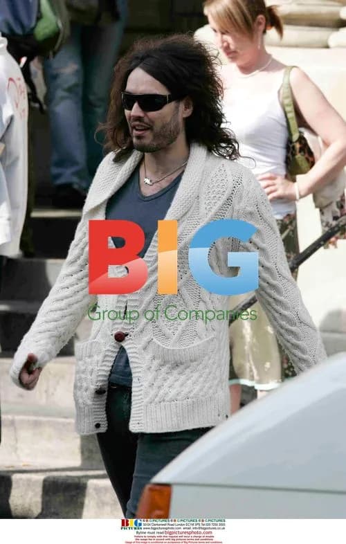Russell Brand exits London church