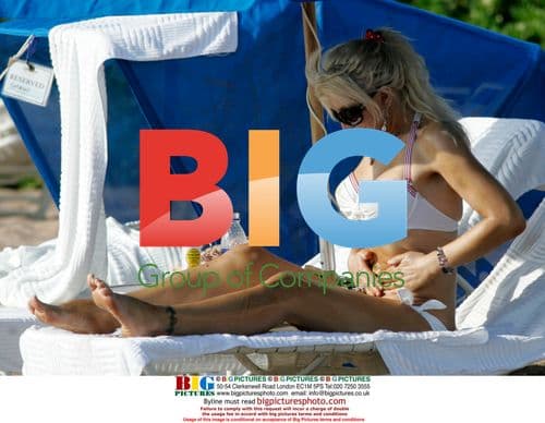 Courtney Love Goofs Around with Paparazzi in Maui