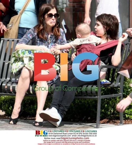Parker Posey shopping with friends, interacting with baby