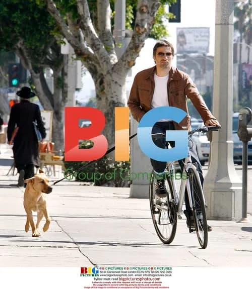 Olivier Martinez Riding Bike with Dog