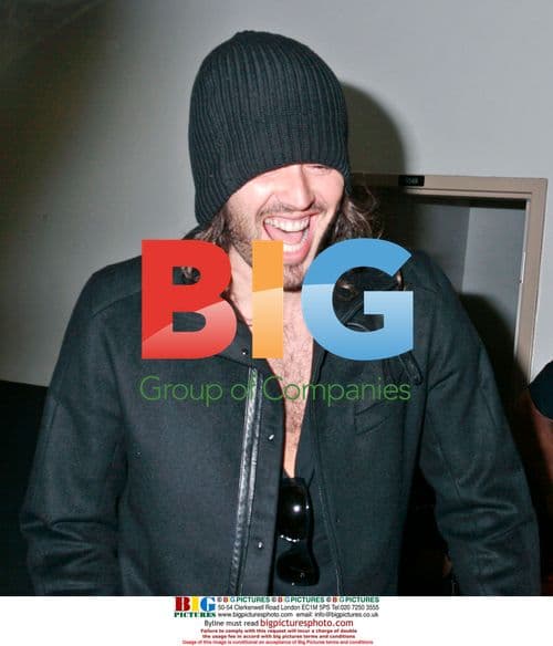 Russell Brand and Girlfriend Arrive at LAX