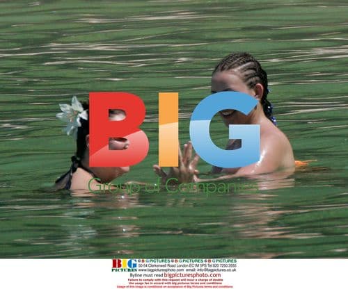 Charlotte Church and Gavin Henderson's sister on beach in Thailand