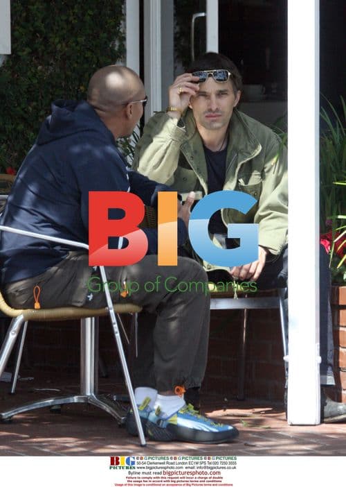 Olivier Martinez chats with friend at Fred Segal