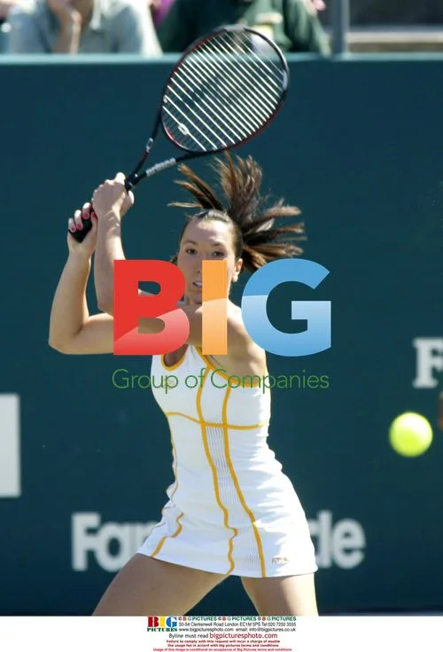 Jelena Jankovic returns ball at Family Circle Cup