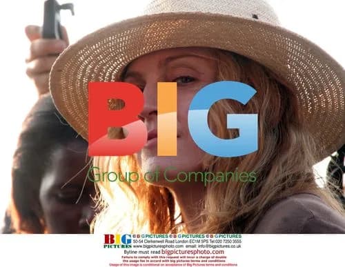 Madonna tours Malawi corn fields with daughter