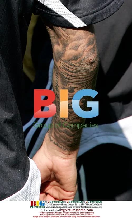 David Beckham shows off tattoos