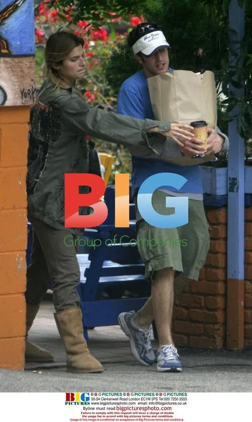 Jason Biggs and Lake Bell cuddle at dog park