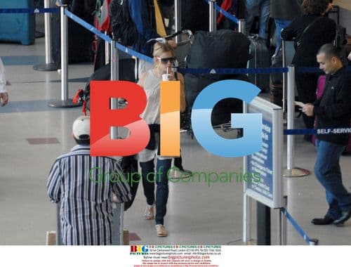 Sienna Miller Arrives at LAX with Beau Jamie Burke