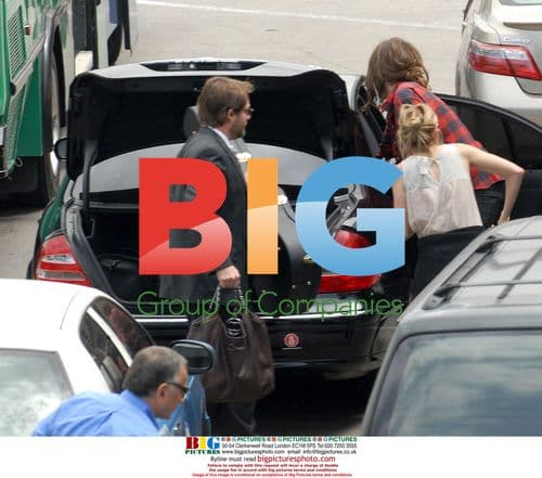 Sienna Miller Arrives at LAX with Boyfriend