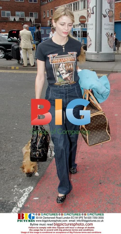 Mischa Barton leaves hotel with dog