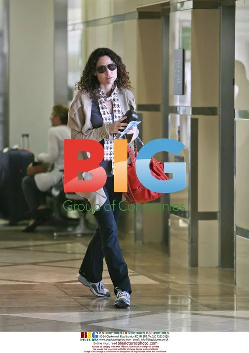 Minnie Driver Departs LAX with Guitar