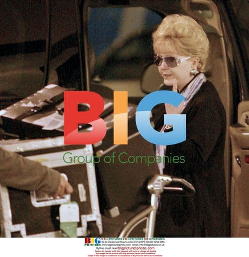 Debbie Reynolds Arrives at LAX in Wheelchair