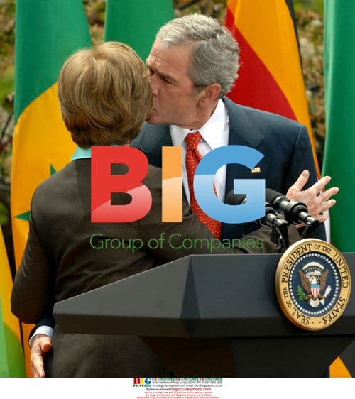 George W. Bush kisses Laura Bush at Malaria event