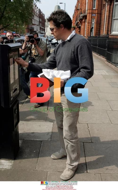 Hugh Grant Leaving House After Paparazzi Incident