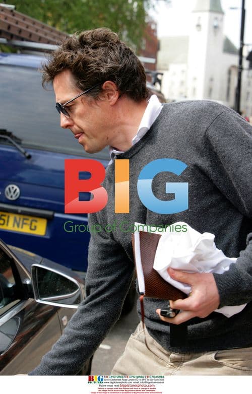Hugh Grant Leaves Home After Photographer Altercation