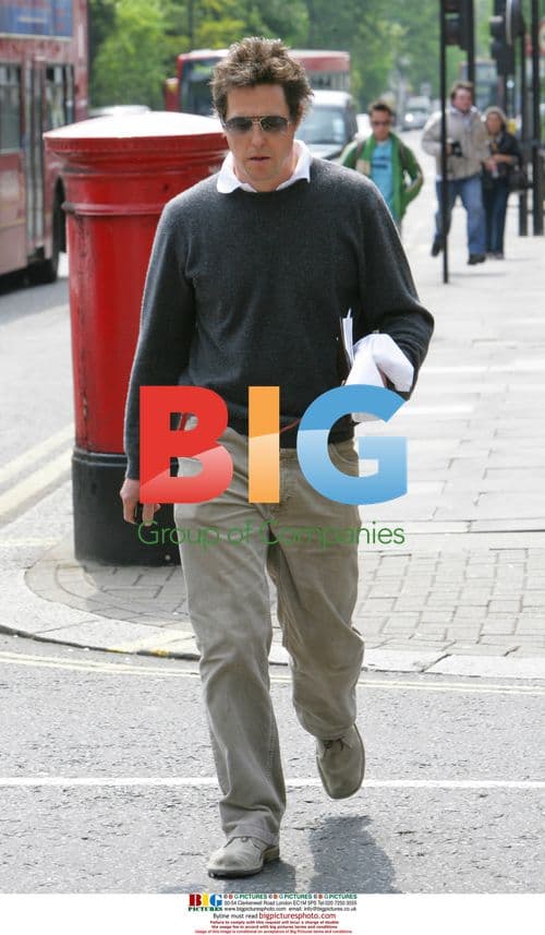 Hugh Grant Leaves House After Paparazzi Incident