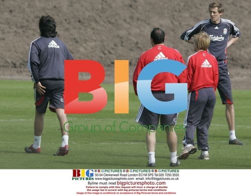 Liverpool Boss Rafa Benitez Attends to Injured Player