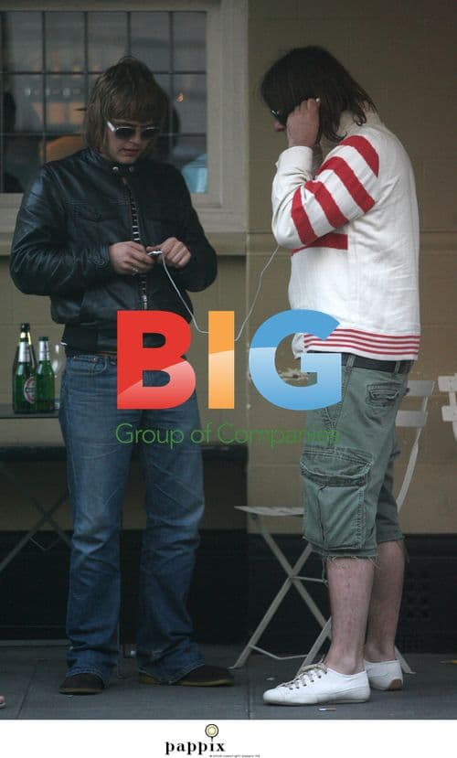 Liam Gallagher relaxing with mates and brother