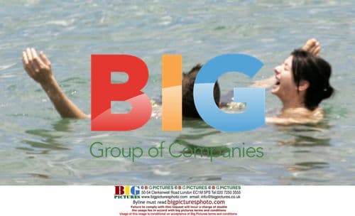 Alyson Hannigan Enjoys Maui Surf with Hubby Alex Denisof