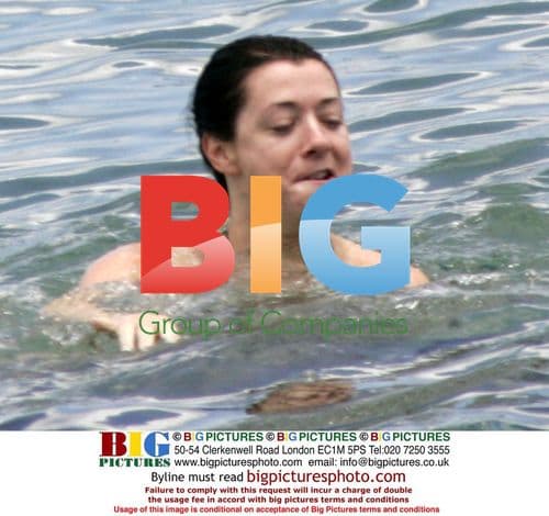 Alyson Hannigan enjoys Maui surf with husband Alex Denisof