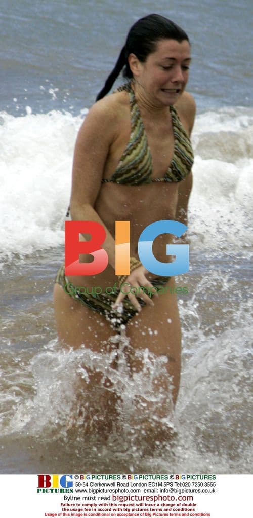 Alyson Hannigan Enjoys Maui Surf with Hubby