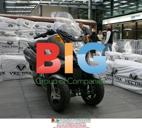 Suzy Perry and Sir Stirling Moss at Vectrix Scooter Launch