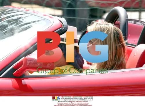 Rod Stewart and Penny Lancaster Drive Ferrari