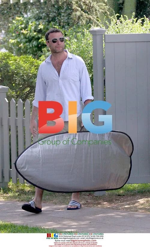 Liev Schreiber Picks Up Surfboard