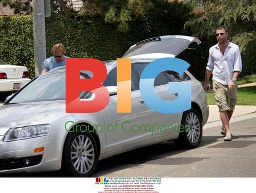 Liev Schreiber Picks Up Surfboard
